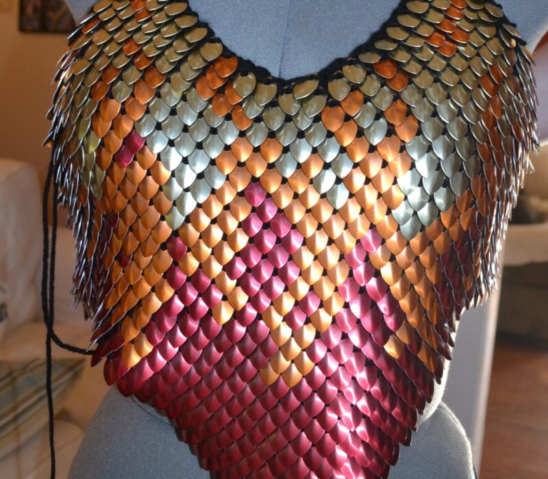 A scalemaille top with a red, orange, and gold fire pattern