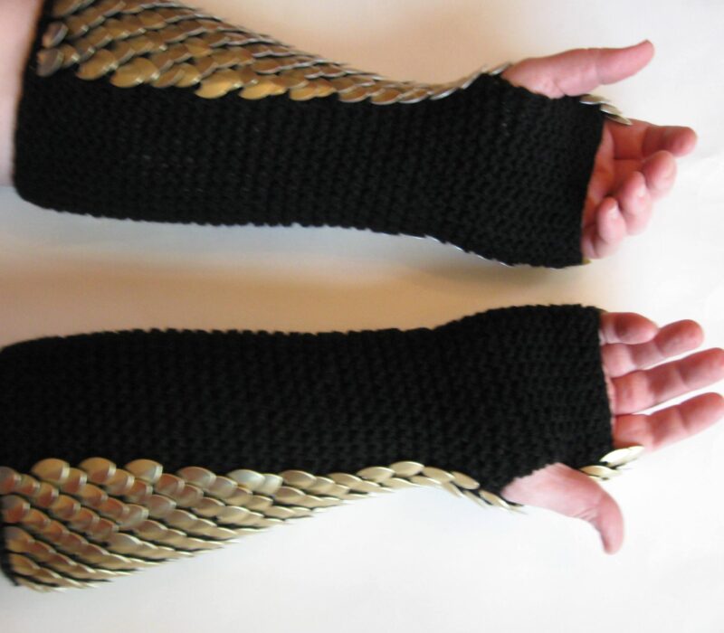 Long gold dragonhide gauntlets on black yarn lining,.