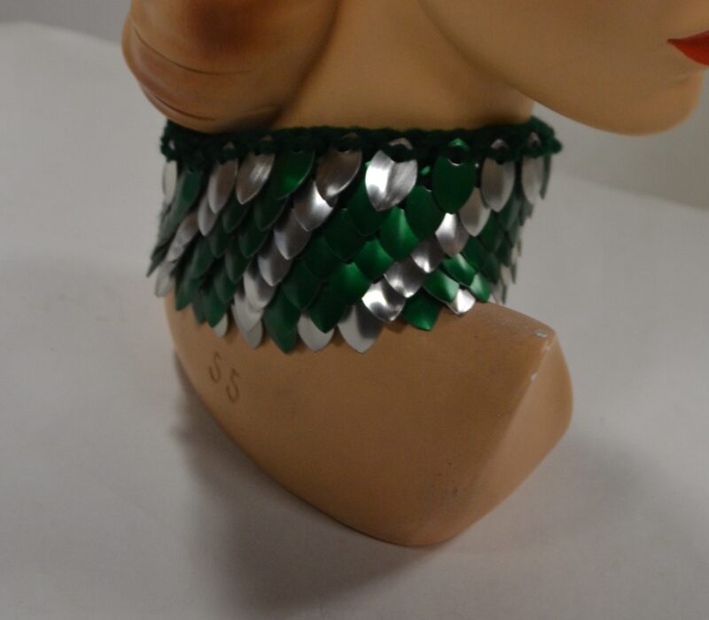 A silver and green striped dragonhide collar